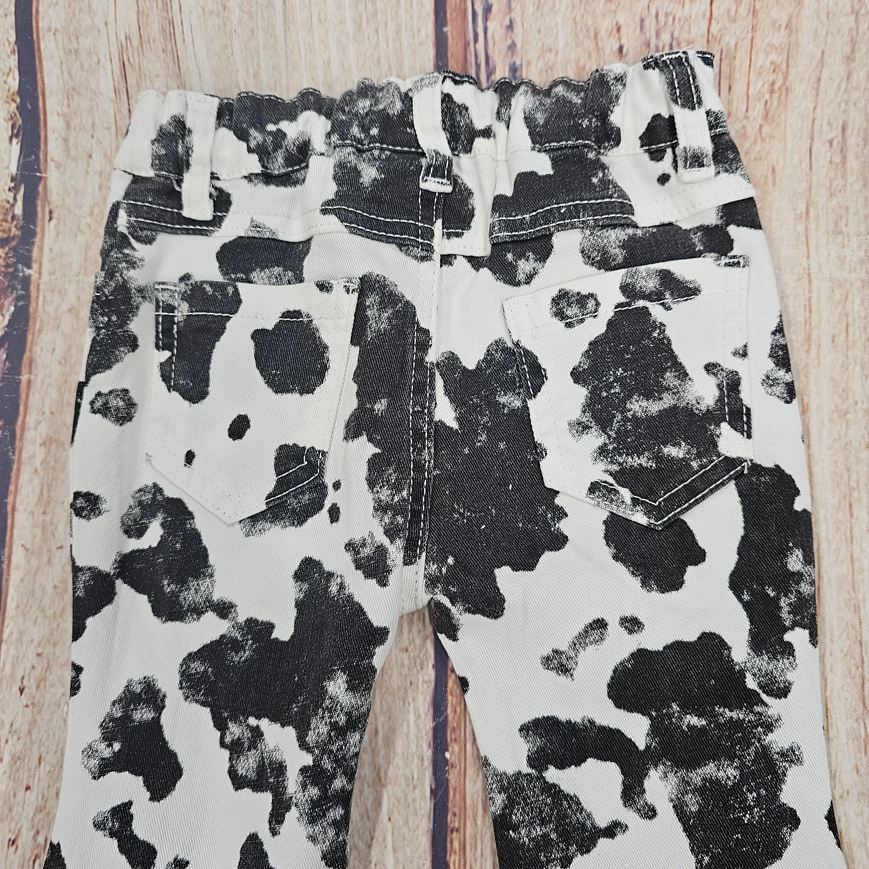 ML KIDS COW PRINT FLAIR JEANS